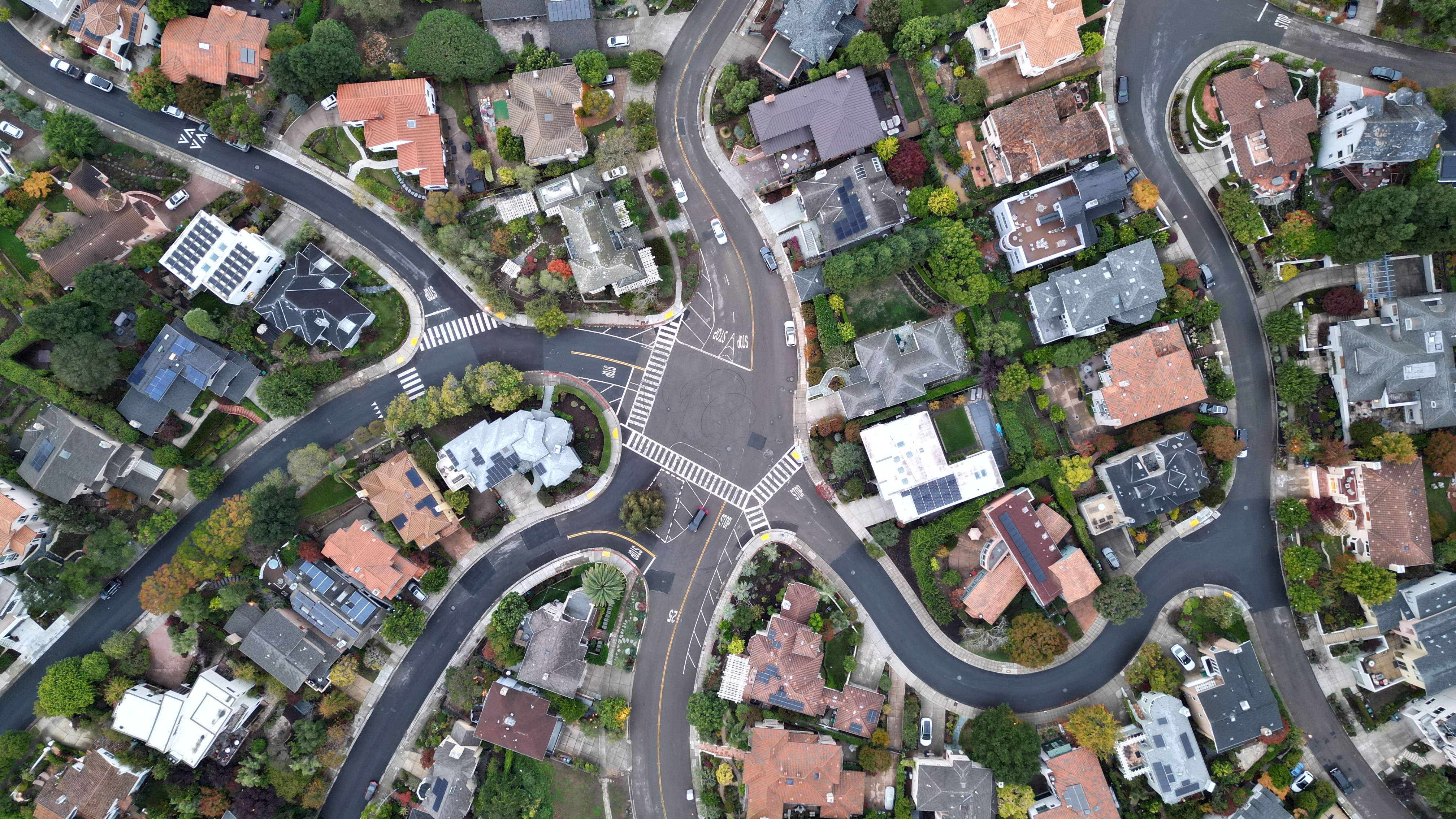 FPV drone flying near a modern glass building